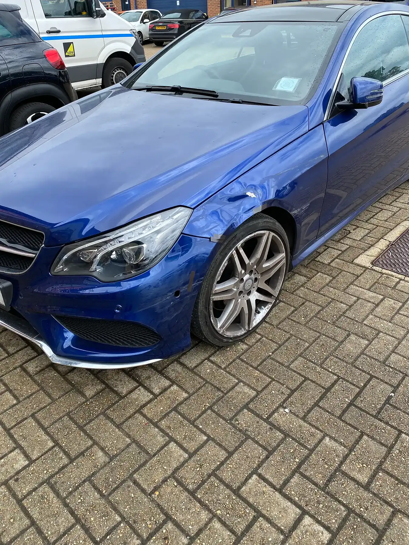 A blue Mercedes Benz